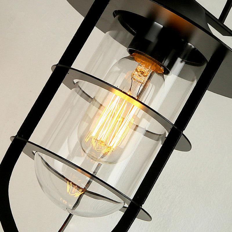 Black Single Wall Light Fixture Industrial Metal Wire Cage Wall Sconce with Clear Glass Shade Clearhalo 'Art deco wall lights' 'Cast Iron' 'Glass' 'Industrial wall lights' 'Industrial' 'Middle century wall lights' 'Modern' 'Rustic wall lights' 'Tiffany' 'Traditional wall lights' 'Wall Lamps & Sconces' 'Wall Lights' Lighting' 2415677
