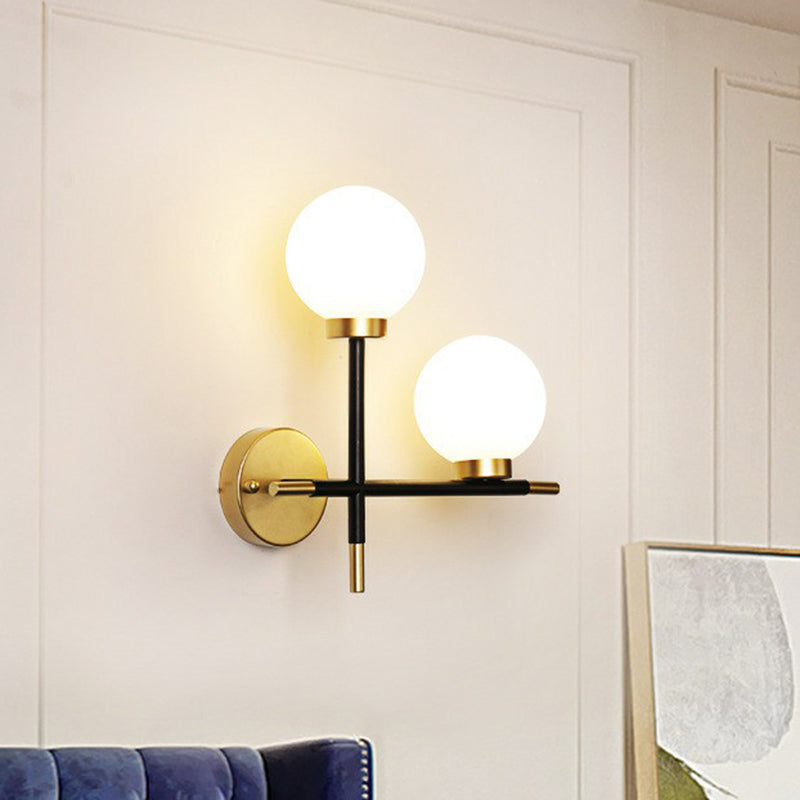 Mini Globe Milk Glass Wall Mount Light Modern 2-Light Black Sconce Fixture for Foyer Clearhalo 'Cast Iron' 'Glass' 'Industrial' 'Modern wall lights' 'Modern' 'Tiffany' 'Traditional wall lights' 'Wall Lamps & Sconces' 'Wall Lights' Lighting' 2423033
