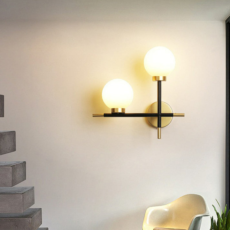 Mini Globe Milk Glass Wall Mount Light Modern 2-Light Black Sconce Fixture for Foyer Clearhalo 'Cast Iron' 'Glass' 'Industrial' 'Modern wall lights' 'Modern' 'Tiffany' 'Traditional wall lights' 'Wall Lamps & Sconces' 'Wall Lights' Lighting' 2423036