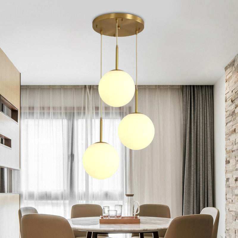 Sphere Opal Glass Multiple Lamp Pendant Minimalism 3-Bulb Gold Pendulum Light for Dining Room Gold 12" Clearhalo 'Ceiling Lights' 'Modern Pendants' 'Modern' 'Pendant Lights' 'Pendants' Lighting' 2423071
