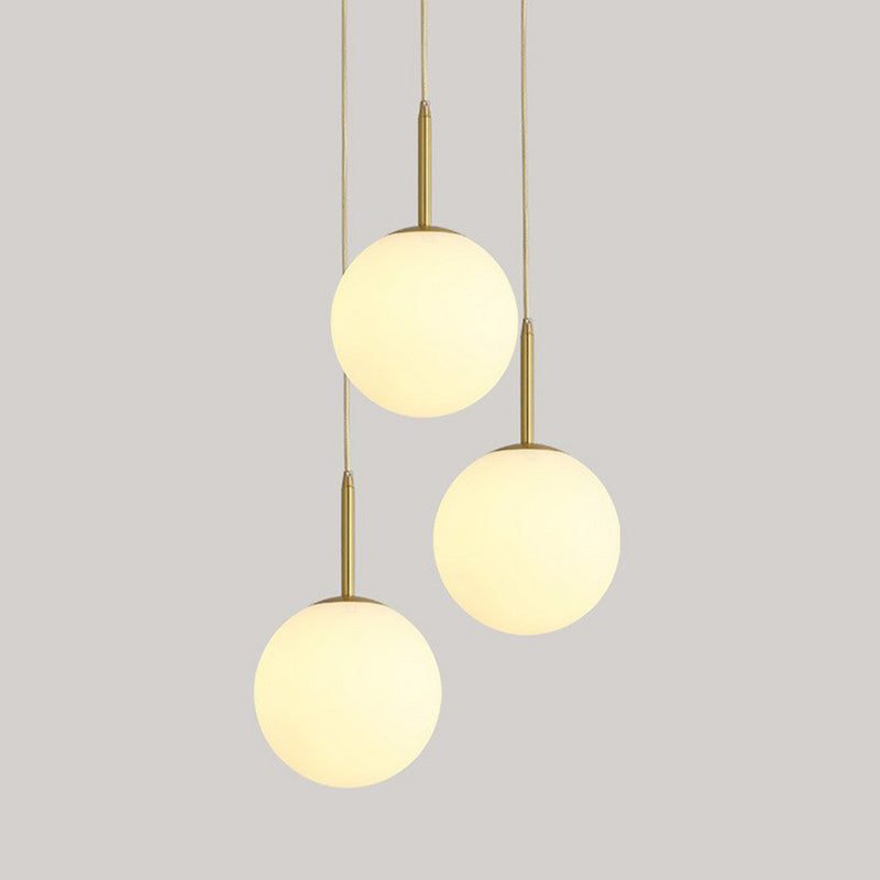 Sphere Opal Glass Multiple Lamp Pendant Minimalism 3-Bulb Gold Pendulum Light for Dining Room Clearhalo 'Ceiling Lights' 'Modern Pendants' 'Modern' 'Pendant Lights' 'Pendants' Lighting' 2423072