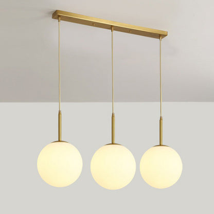 Sphere Opal Glass Multiple Lamp Pendant Minimalism 3-Bulb Gold Pendulum Light for Dining Room Gold 23.5" Clearhalo 'Ceiling Lights' 'Modern Pendants' 'Modern' 'Pendant Lights' 'Pendants' Lighting' 2423074