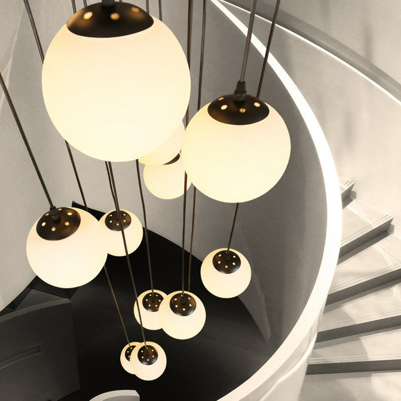 Black Globe Pendant Light Fixture Simple Cream Glass Multiple Hanging Light for Stairs Clearhalo 'Ceiling Lights' 'Modern Pendants' 'Modern' 'Pendant Lights' 'Pendants' Lighting' 2424515