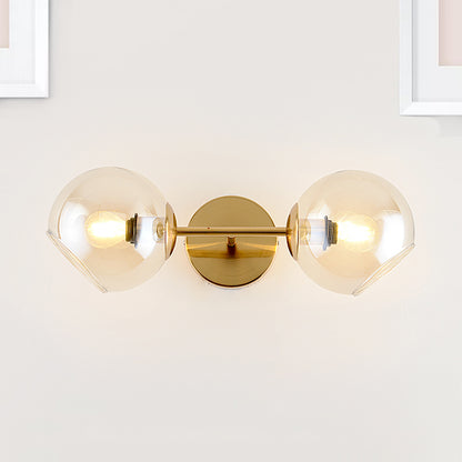 Modernist 2 Lights Wall Lamp with Clear Glass Shade Gold Spherical Wall Mount Light Fixture Gold Clearhalo 'Cast Iron' 'Glass' 'Industrial' 'Modern wall lights' 'Modern' 'Tiffany' 'Traditional wall lights' 'Wall Lamps & Sconces' 'Wall Lights' Lighting' 242547