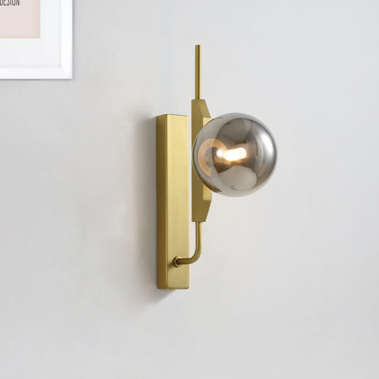 Led Bedroom Sconce Lighting with Sphere Smoky/White/Amber Glass Shade Modernist Brass Wall Mount Light Smoke Gray Clearhalo 'Cast Iron' 'Glass' 'Industrial' 'Modern wall lights' 'Modern' 'Tiffany' 'Traditional wall lights' 'Wall Lamps & Sconces' 'Wall Lights' Lighting' 242934