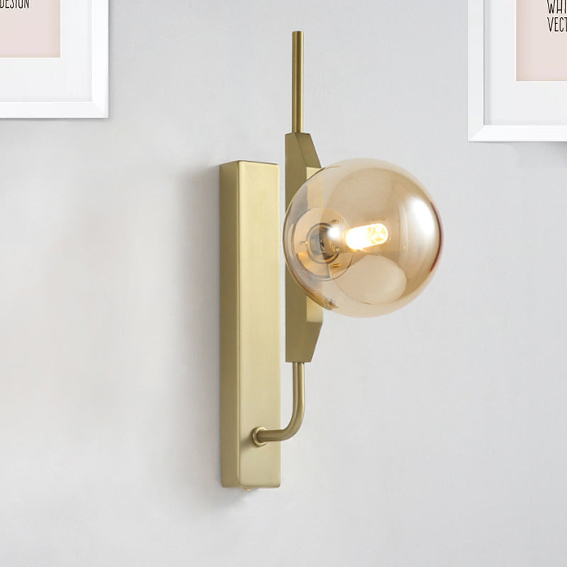 Led Bedroom Sconce Lighting with Sphere Smoky/White/Amber Glass Shade Modernist Brass Wall Mount Light Amber Clearhalo 'Cast Iron' 'Glass' 'Industrial' 'Modern wall lights' 'Modern' 'Tiffany' 'Traditional wall lights' 'Wall Lamps & Sconces' 'Wall Lights' Lighting' 242936