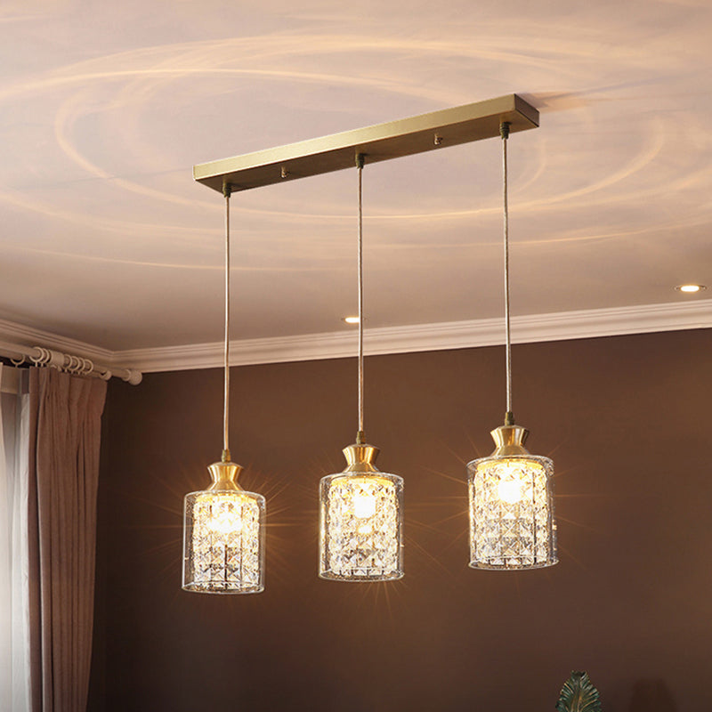 Postmodern Shaded Multiple Hanging Light Crystal 3 Heads Dining Room Suspension Pendant in Gold Gold Cylinder Clearhalo 'Ceiling Lights' 'Modern Pendants' 'Modern' 'Pendant Lights' 'Pendants' Lighting' 2460641