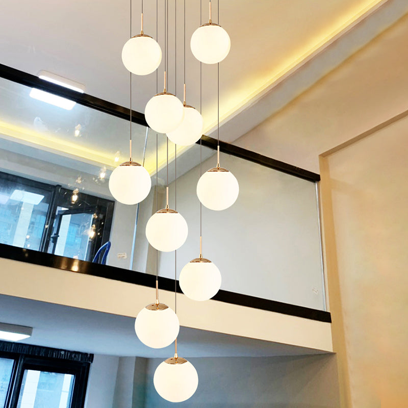 Cream Glass Bubbles Multi Pendant Ceiling Light Minimalism White Glass Staircase Suspension Light in Gold Clearhalo 'Ceiling Lights' 'Modern Pendants' 'Modern' 'Pendant Lights' 'Pendants' Lighting' 2461333