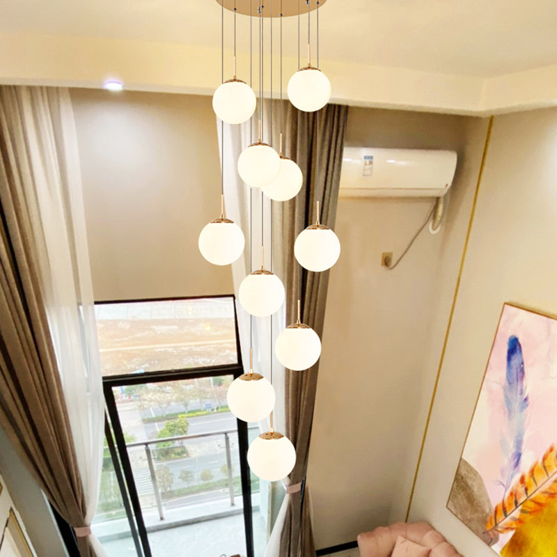 Cream Glass Bubbles Multi Pendant Ceiling Light Minimalism White Glass Staircase Suspension Light in Gold Clearhalo 'Ceiling Lights' 'Modern Pendants' 'Modern' 'Pendant Lights' 'Pendants' Lighting' 2461334
