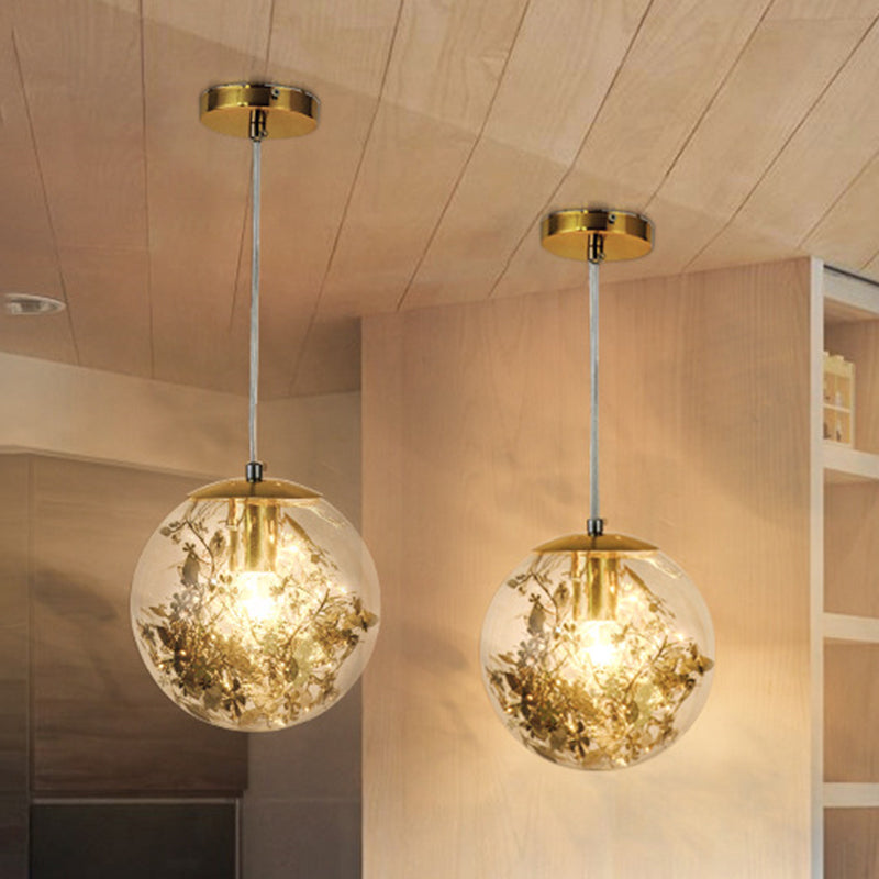 Globe Suspension Lighting Simple Clear Glass 1-Head Dining Room Pendant Light with Foil Flower Inside Clearhalo 'Ceiling Lights' 'Close To Ceiling Lights' 'Glass shade' 'Glass' 'Modern Pendants' 'Modern' 'Pendant Lights' 'Pendants' Lighting' 2461755