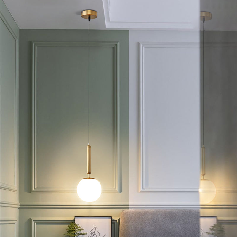 Minimalist Ball Hanging Ceiling Light Opal Blown Glass 1 Bulb Bedside Pendulum Light in Gold Clearhalo 'Ceiling Lights' 'Chandeliers' 'Glass shade' 'Glass' 'Modern Pendants' 'Modern' 'Pendant Lights' 'Pendants' Lighting' 2462551