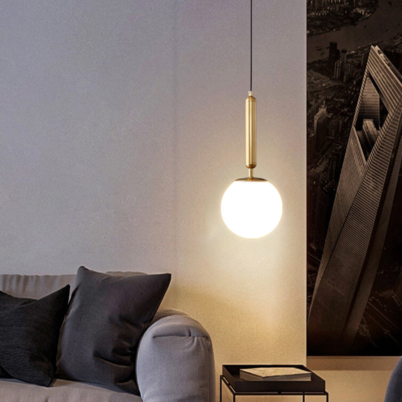 Minimalist Ball Hanging Ceiling Light Opal Blown Glass 1 Bulb Bedside Pendulum Light in Gold Clearhalo 'Ceiling Lights' 'Chandeliers' 'Glass shade' 'Glass' 'Modern Pendants' 'Modern' 'Pendant Lights' 'Pendants' Lighting' 2462552