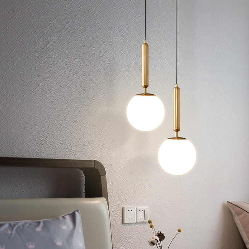 Minimalist Ball Hanging Ceiling Light Opal Blown Glass 1 Bulb Bedside Pendulum Light in Gold Clearhalo 'Ceiling Lights' 'Chandeliers' 'Glass shade' 'Glass' 'Modern Pendants' 'Modern' 'Pendant Lights' 'Pendants' Lighting' 2462553