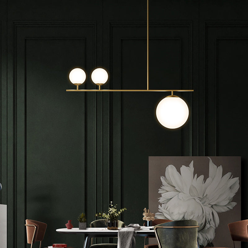 Brass Ball Pendant Light Minimalistic 3-Light Opal Glass Island Lighting for Dining Room Clearhalo 'Ceiling Lights' 'Island Lights' Lighting' 2464947