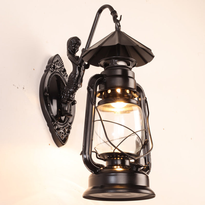 Single-Bulb Oil Lantern Sconce Antique Style Clear Glass Wall Mount Light Fixture for Aisle Black Mermaid Clearhalo 'Art deco wall lights' 'Cast Iron' 'Glass' 'Industrial wall lights' 'Industrial' 'Middle century wall lights' 'Modern' 'Rustic wall lights' 'Tiffany' 'Traditional wall lights' 'Wall Lamps & Sconces' 'Wall Lights' Lighting' 2465733