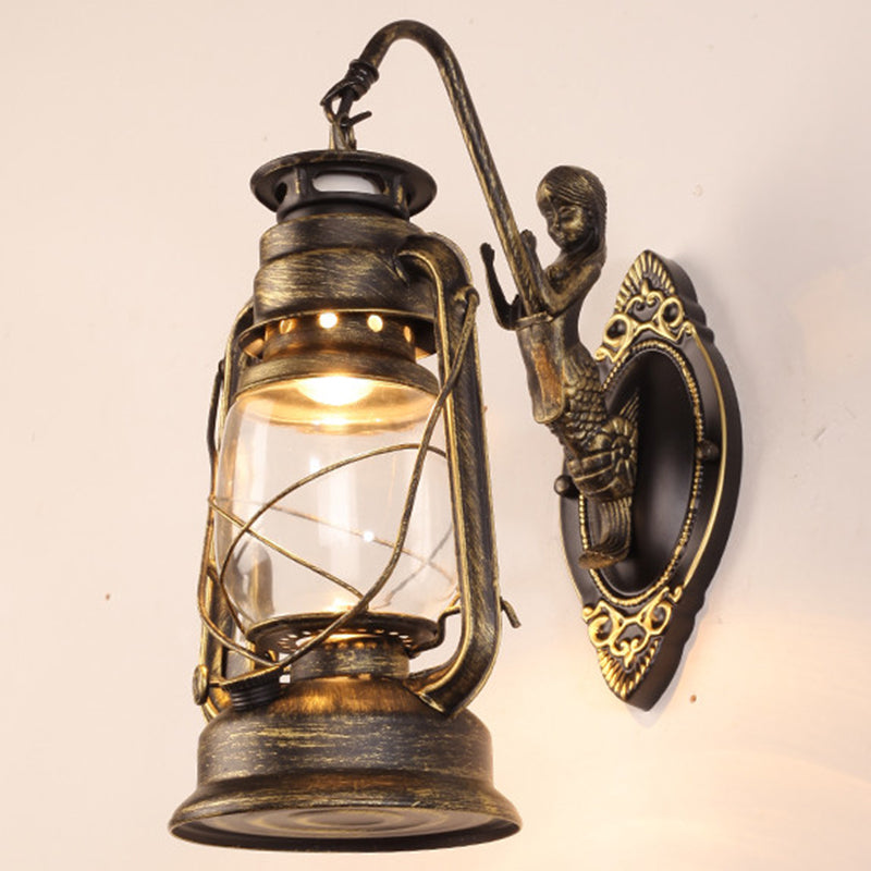Single-Bulb Oil Lantern Sconce Antique Style Clear Glass Wall Mount Light Fixture for Aisle Bronze Arc Clearhalo 'Art deco wall lights' 'Cast Iron' 'Glass' 'Industrial wall lights' 'Industrial' 'Middle century wall lights' 'Modern' 'Rustic wall lights' 'Tiffany' 'Traditional wall lights' 'Wall Lamps & Sconces' 'Wall Lights' Lighting' 2465734