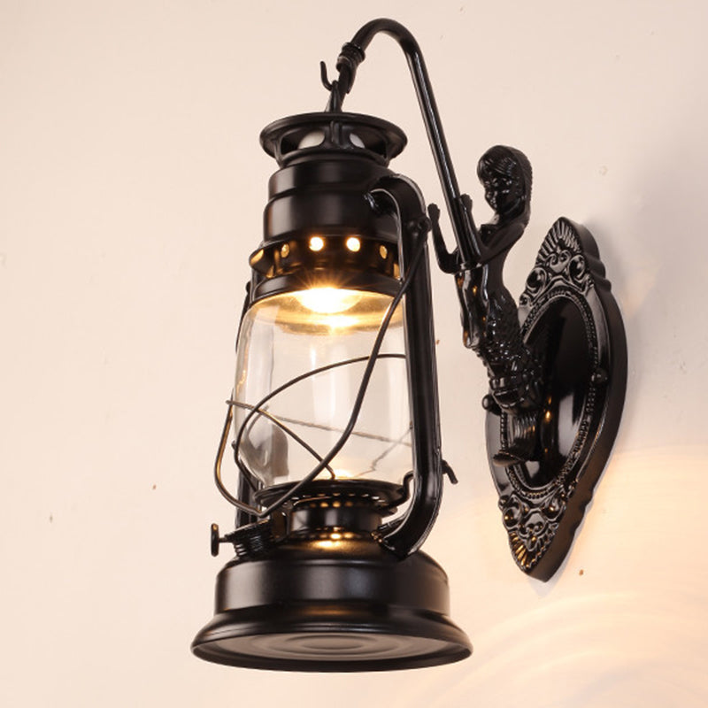 Single-Bulb Oil Lantern Sconce Antique Style Clear Glass Wall Mount Light Fixture for Aisle Black Arc Clearhalo 'Art deco wall lights' 'Cast Iron' 'Glass' 'Industrial wall lights' 'Industrial' 'Middle century wall lights' 'Modern' 'Rustic wall lights' 'Tiffany' 'Traditional wall lights' 'Wall Lamps & Sconces' 'Wall Lights' Lighting' 2465736