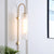 Mid-Century Gooseneck Wall Light Metal 1-Light Living Room Wall Sconce with Flute Glass Shade White Clearhalo 'Cast Iron' 'Glass' 'Industrial' 'Modern wall lights' 'Modern' 'Tiffany' 'Traditional wall lights' 'Wall Lamps & Sconces' 'Wall Lights' Lighting' 2466073