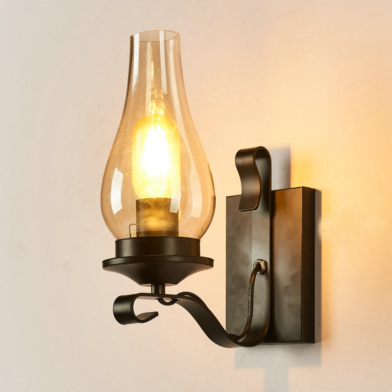 Rustic Paraffin Lantern Wall Sconce 1-Head Clear Glass Wall Lighting for Living Room Black Curved Clearhalo 'Art deco wall lights' 'Cast Iron' 'Glass' 'Industrial wall lights' 'Industrial' 'Middle century wall lights' 'Modern' 'Rustic wall lights' 'Tiffany' 'Traditional wall lights' 'Wall Lamps & Sconces' 'Wall Lights' Lighting' 2466486