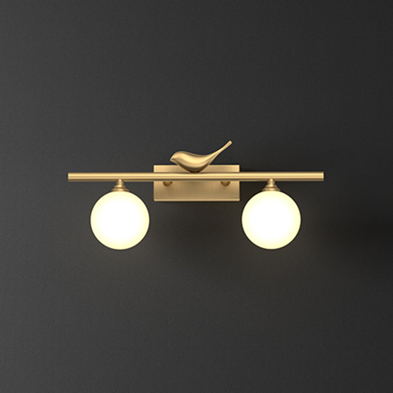 Ball Bathroom Vanity Sconce Opal Glass Postmodern Wall Light with Bird Decor in Brass 2.0 Brass Clearhalo 'Cast Iron' 'Glass' 'Industrial' 'Modern wall lights' 'Modern' 'Tiffany' 'Traditional wall lights' 'Vanity Lights' 'Wall Lights' Lighting' 2467202