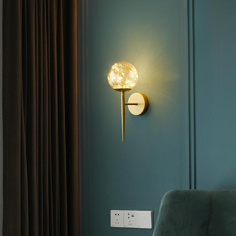 Ball Shaped Wall Light Fixture Postmodern Clear Glass Gold Wall Sconce with Starry LED String Gold Single Arm Clearhalo 'Cast Iron' 'Glass' 'Industrial' 'Modern wall lights' 'Modern' 'Tiffany' 'Traditional wall lights' 'Wall Lamps & Sconces' 'Wall Lights' Lighting' 2467323