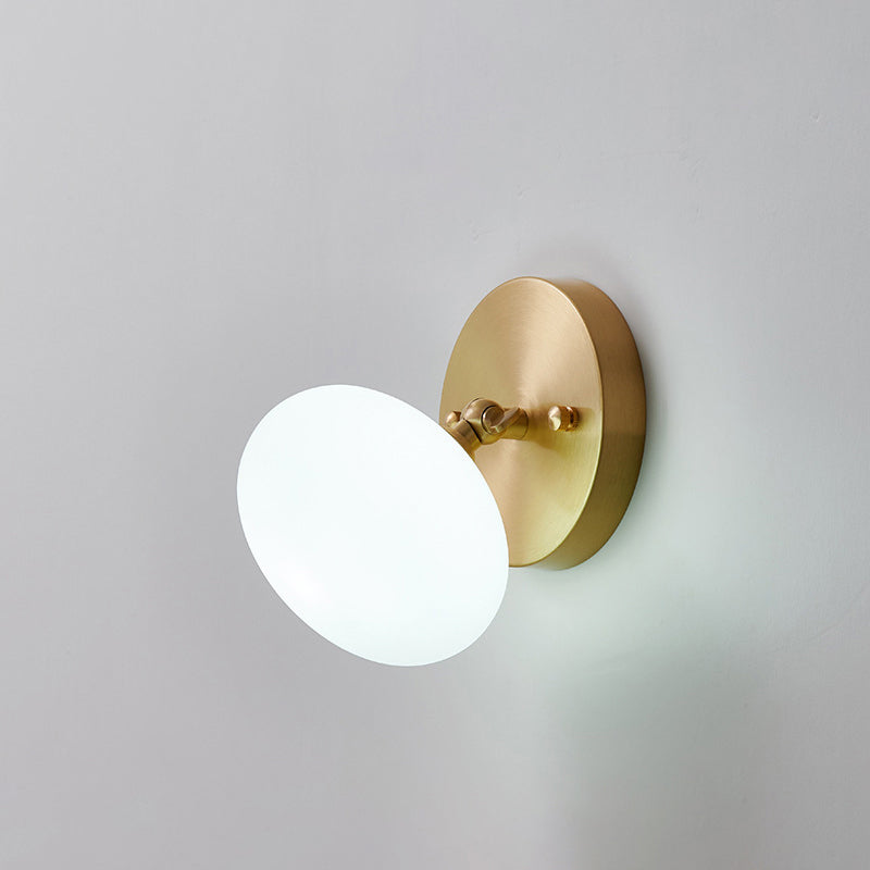 Small Corridor Rotatable Wall Sconce Glass Single Postmodern Wall Mounted Light in Brass Brass Ellipsoidal Clearhalo 'Cast Iron' 'Glass' 'Industrial' 'Modern wall lights' 'Modern' 'Tiffany' 'Traditional wall lights' 'Wall Lamps & Sconces' 'Wall Lights' Lighting' 2467496