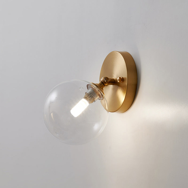 Small Corridor Rotatable Wall Sconce Glass Single Postmodern Wall Mounted Light in Brass Brass Globe Clearhalo 'Cast Iron' 'Glass' 'Industrial' 'Modern wall lights' 'Modern' 'Tiffany' 'Traditional wall lights' 'Wall Lamps & Sconces' 'Wall Lights' Lighting' 2467502