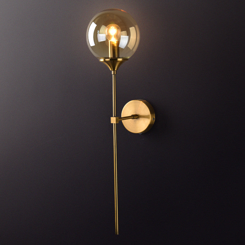 Brass Pencil Arm Wall Lamp Postmodern 1 Head Metal Sconce Light with Ball Glass Shade Amber Clearhalo 'Cast Iron' 'Glass' 'Industrial' 'Modern wall lights' 'Modern' 'Tiffany' 'Traditional wall lights' 'Wall Lamps & Sconces' 'Wall Lights' Lighting' 2467896