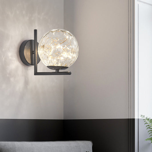 Glass Mini Globe Wall Sconce Designer Style LED Wall Mount Light Fixture for Bedroom Clearhalo 'Cast Iron' 'Glass' 'Industrial' 'Modern wall lights' 'Modern' 'Tiffany' 'Traditional wall lights' 'Wall Lamps & Sconces' 'Wall Lights' Lighting' 2467903