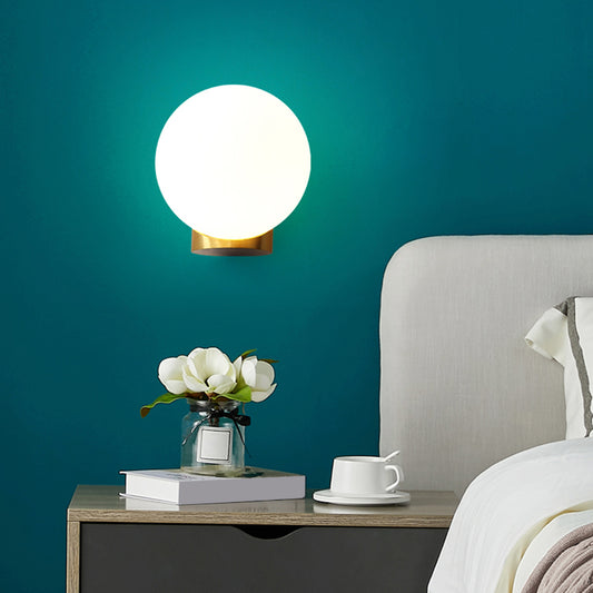 Simple Spherical Wall Mount Lamp Opal Glass 1 Bulb Bedside Wall Sconce Light in Brass Brass Clearhalo 'Cast Iron' 'Glass' 'Industrial' 'Modern wall lights' 'Modern' 'Tiffany' 'Traditional wall lights' 'Wall Lamps & Sconces' 'Wall Lights' Lighting' 2468027