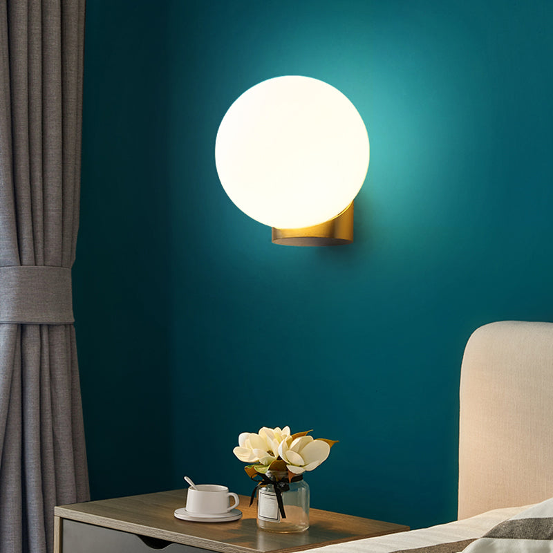 Simple Spherical Wall Mount Lamp Opal Glass 1 Bulb Bedside Wall Sconce Light in Brass Clearhalo 'Cast Iron' 'Glass' 'Industrial' 'Modern wall lights' 'Modern' 'Tiffany' 'Traditional wall lights' 'Wall Lamps & Sconces' 'Wall Lights' Lighting' 2468030