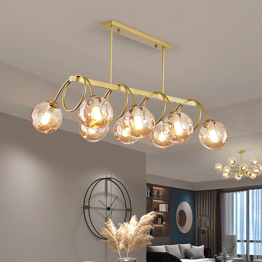 Gold Finish Spiral Island Light Post-Modern Metal Ceiling Hang Lamp with Ball Dimpled Glass Shade Clearhalo 'Ceiling Lights' 'Island Lights' Lighting' 2468069