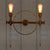 1/2-Head Bare Bulb Wall Mount Light Industrial Style Silver/Bronze/Antique Brass Wrought Iron Wall Lighting with Wheel Decoration 2.0 Antique Brass Clearhalo 'Art deco wall lights' 'Cast Iron' 'Glass' 'Industrial wall lights' 'Industrial' 'Middle century wall lights' 'Modern' 'Rustic wall lights' 'Tiffany' 'Traditional wall lights' 'Wall Lamps & Sconces' 'Wall Lights' Lighting' 248226