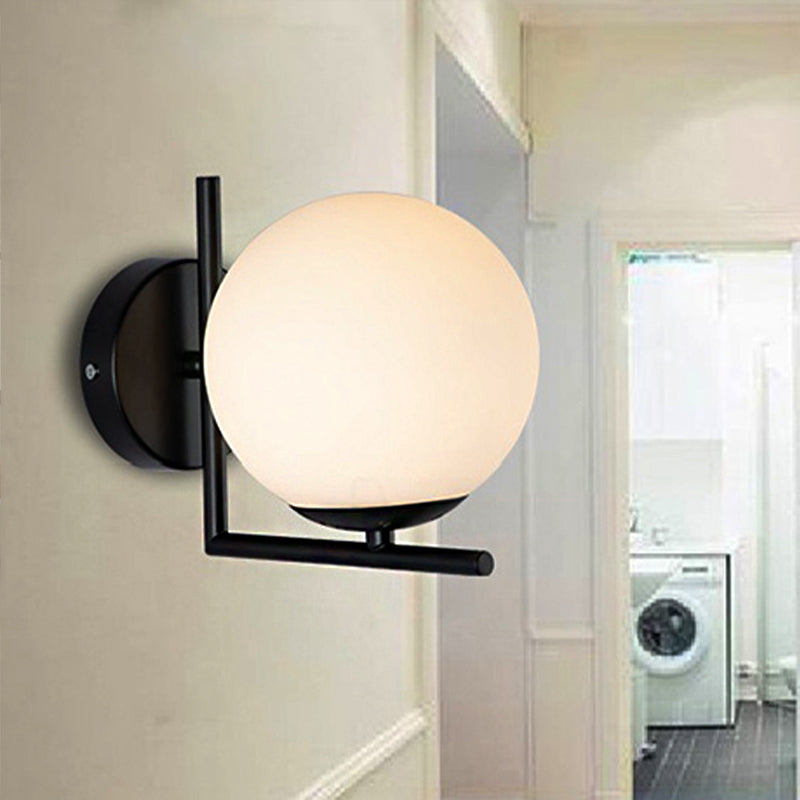 1 Bulb Globe Wall Mounted Light Fixture Modern Black Opal Glass Lighting with Frame Decoration Clearhalo 'Cast Iron' 'Glass' 'Industrial' 'Modern wall lights' 'Modern' 'Tiffany' 'Traditional wall lights' 'Wall Lamps & Sconces' 'Wall Lights' Lighting' 250618
