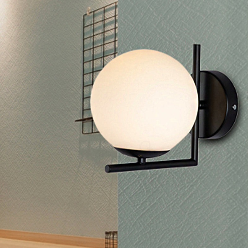 1 Bulb Globe Wall Mounted Light Fixture Modern Black Opal Glass Lighting with Frame Decoration Clearhalo 'Cast Iron' 'Glass' 'Industrial' 'Modern wall lights' 'Modern' 'Tiffany' 'Traditional wall lights' 'Wall Lamps & Sconces' 'Wall Lights' Lighting' 250619