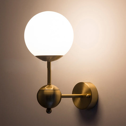 Modern Globe Wall Lighting Fixture 1 Bulb White Glass Sconce Light in Brass for Bathroom Clearhalo 'Cast Iron' 'Glass' 'Industrial' 'Modern wall lights' 'Modern' 'Tiffany' 'Traditional wall lights' 'Wall Lamps & Sconces' 'Wall Lights' Lighting' 250622