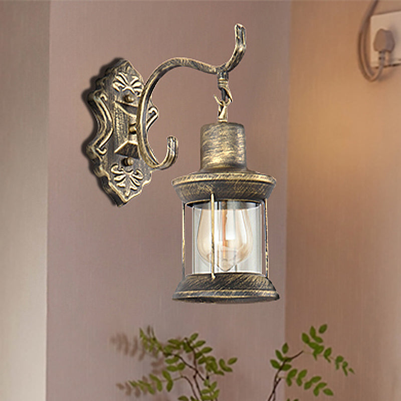 1 Bulb Kerosene Wall Mounted Light Fixture Rustic Style Aged Bronze Clear Glass Lighting with Carved Pattern Bronze Clearhalo 'Art deco wall lights' 'Cast Iron' 'Glass' 'Industrial wall lights' 'Industrial' 'Middle century wall lights' 'Modern' 'Rustic wall lights' 'Tiffany' 'Traditional wall lights' 'Wall Lamps & Sconces' 'Wall Lights' Lighting' 250655