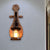 Clear Glass Lantern Wall Sconce Coastal 1 Light Dining Room Lighting Fixture with Spoon Black Clearhalo 'Industrial wall lights' 'Industrial' 'Middle century wall lights' 'Rustic wall lights' 'Tiffany' 'Wall Lamps & Sconces' 'Wall Lights' Lighting' 250690