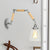 1 Bulb Tapered Wall Mounted Light Fixture Vintage Chrome Clear Glass Lighting with Extendable Arm Clear Clearhalo 'Cast Iron' 'Glass' 'Industrial wall lights' 'Industrial' 'Middle century wall lights' 'Modern' 'Tiffany' 'Traditional wall lights' 'Wall Lamps & Sconces' 'Wall Lights' Lighting' 250965