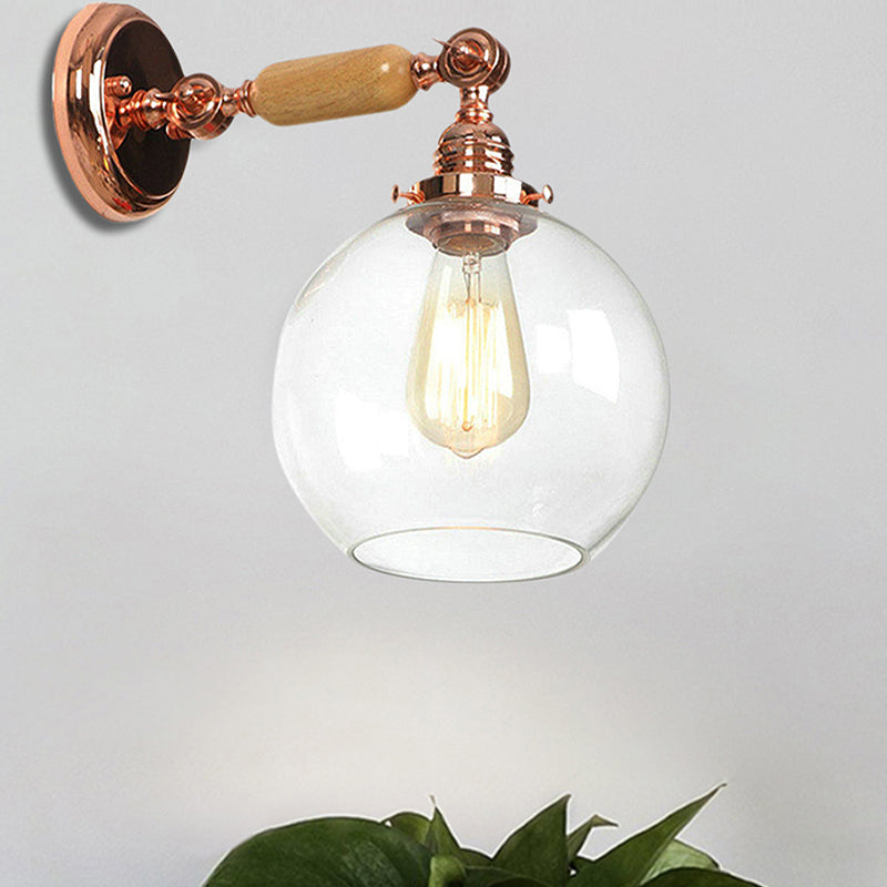 Orb Shade Clear Glass Wall Mounted Lamp Industrial Single Bulb Living Room Sconce Light in Rose Gold Clear Clearhalo 'Cast Iron' 'Glass' 'Industrial wall lights' 'Industrial' 'Middle century wall lights' 'Modern' 'Tiffany' 'Traditional wall lights' 'Wall Lamps & Sconces' 'Wall Lights' Lighting' 251014