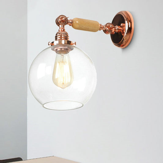 Orb Shade Clear Glass Wall Mounted Lamp Industrial Single Bulb Living Room Sconce Light in Rose Gold Clearhalo 'Cast Iron' 'Glass' 'Industrial wall lights' 'Industrial' 'Middle century wall lights' 'Modern' 'Tiffany' 'Traditional wall lights' 'Wall Lamps & Sconces' 'Wall Lights' Lighting' 251015