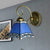 Blue Pyramid Wall Lighting Nautical Mission 1 Light Stained Glass Wall Mount Light for Foyer Blue Curved Clearhalo 'Industrial' 'Middle century wall lights' 'Tiffany wall lights' 'Tiffany' 'Wall Lamps & Sconces' 'Wall Lights' Lighting' 252842