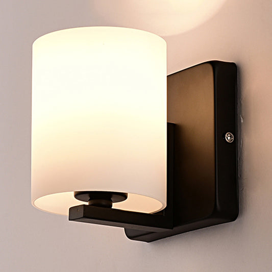 White Shade Sconce Light with Black Base 1 Light Modern Style Milk Glass Wall Sconce for Living Room Black B Clearhalo 'Cast Iron' 'Glass' 'Industrial' 'Modern wall lights' 'Modern' 'Tiffany' 'Traditional wall lights' 'Wall Lamps & Sconces' 'Wall Lights' Lighting' 253020