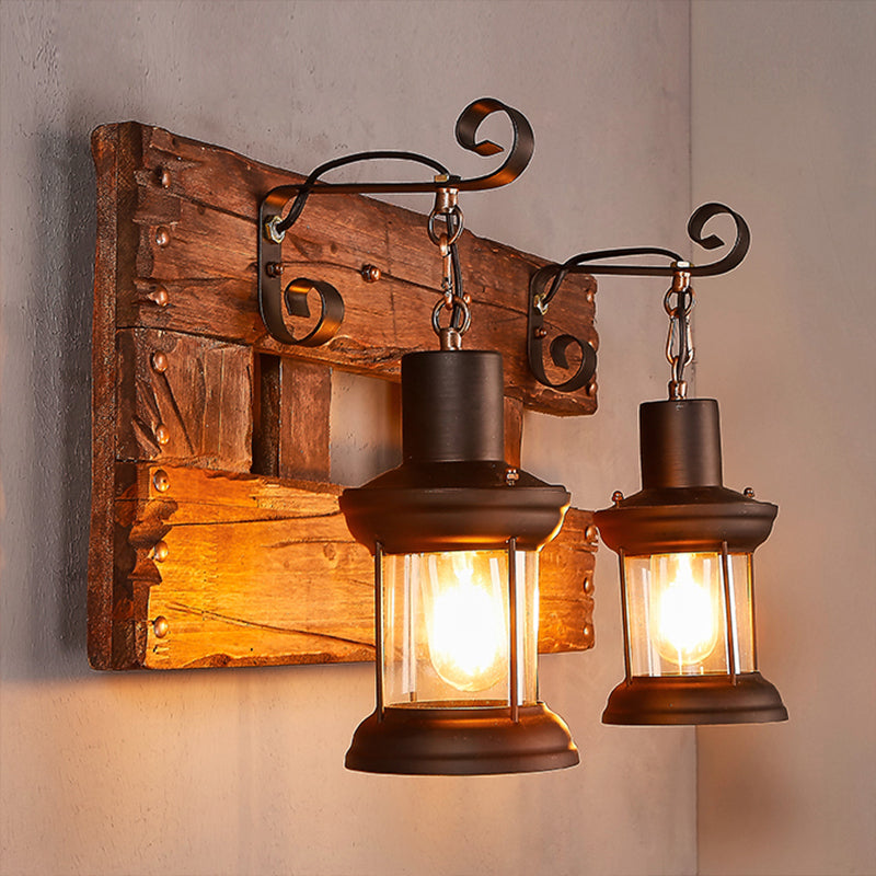 Clear Glass Black Wall Sconce Lighting Lantern 2-Light Industrial Light Fixture with Wooden Backplate Wood Clearhalo 'Industrial wall lights' 'Industrial' 'Middle century wall lights' 'Rustic wall lights' 'Tiffany' 'Wall Lamps & Sconces' 'Wall Lights' Lighting' 253098
