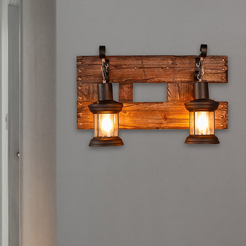Clear Glass Black Wall Sconce Lighting Lantern 2-Light Industrial Light Fixture with Wooden Backplate Clearhalo 'Industrial wall lights' 'Industrial' 'Middle century wall lights' 'Rustic wall lights' 'Tiffany' 'Wall Lamps & Sconces' 'Wall Lights' Lighting' 253099
