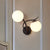 Modern Globe Wall Lighting Fixture 2 Bulbs Milky Glass Sconce Light in Black White Clearhalo 'Cast Iron' 'Glass' 'Industrial' 'Modern wall lights' 'Modern' 'Tiffany' 'Traditional wall lights' 'Wall Lamps & Sconces' 'Wall Lights' Lighting' 253376