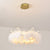 Feather Crown Suspension Lighting Nordic Gold and White Chandelier for Girls Room 1 Gold Clearhalo 'Ceiling Lights' 'Chandeliers' 'Modern Chandeliers' 'Modern' Lighting' 2546709