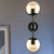 Black 2-Light Sconce Light Industrial Amber Glass Globe Shade Lighting Fixture for Living Room Amber Clearhalo 'Art deco wall lights' 'Cast Iron' 'Glass' 'Industrial wall lights' 'Industrial' 'Middle century wall lights' 'Modern' 'Rustic wall lights' 'Tiffany' 'Traditional wall lights' 'Wall Lamps & Sconces' 'Wall Lights' Lighting' 255306