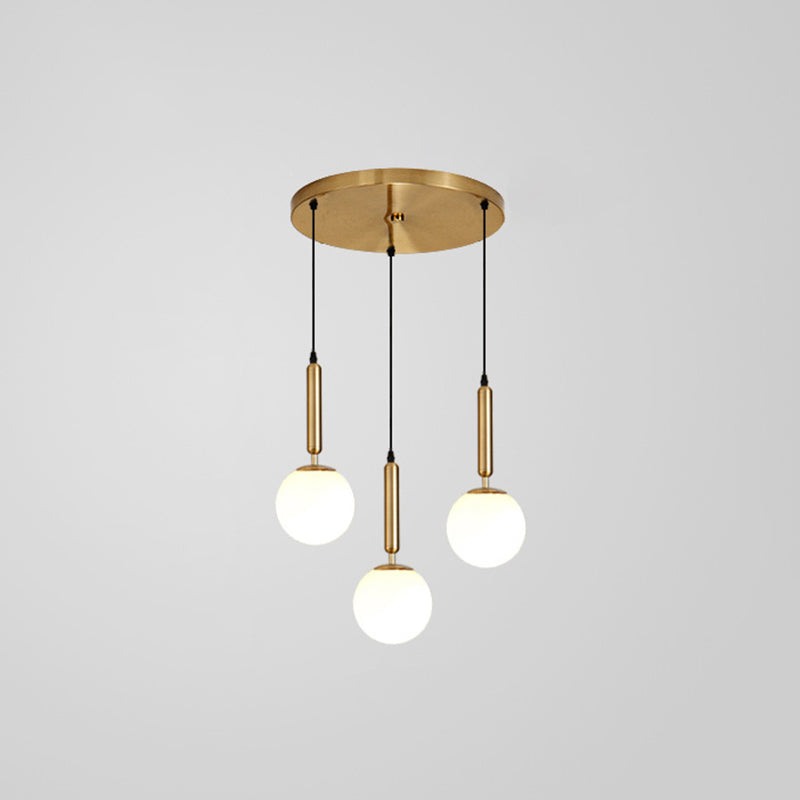 Modern Minimalist Multiple Globe Shade Pendant Light Metal Long Hanging Lamp for Living Room 3 Brass Clearhalo 'Ceiling Lights' 'Close To Ceiling Lights' 'Glass shade' 'Glass' 'Modern Pendants' 'Modern' 'Pendant Lights' 'Pendants' Lighting' 2556874