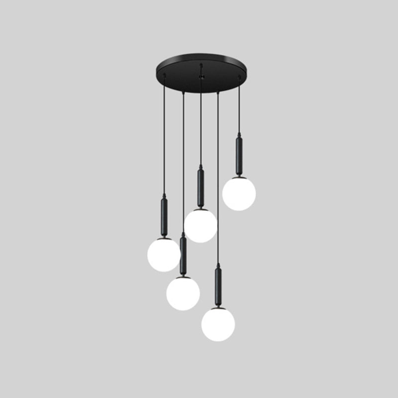 Modern Minimalist Multiple Globe Shade Pendant Light Metal Long Hanging Lamp for Living Room 5 Black Clearhalo 'Ceiling Lights' 'Close To Ceiling Lights' 'Glass shade' 'Glass' 'Modern Pendants' 'Modern' 'Pendant Lights' 'Pendants' Lighting' 2556890